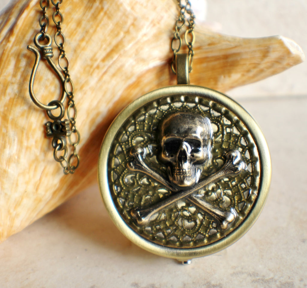 Skull and Crossbones music box locket.