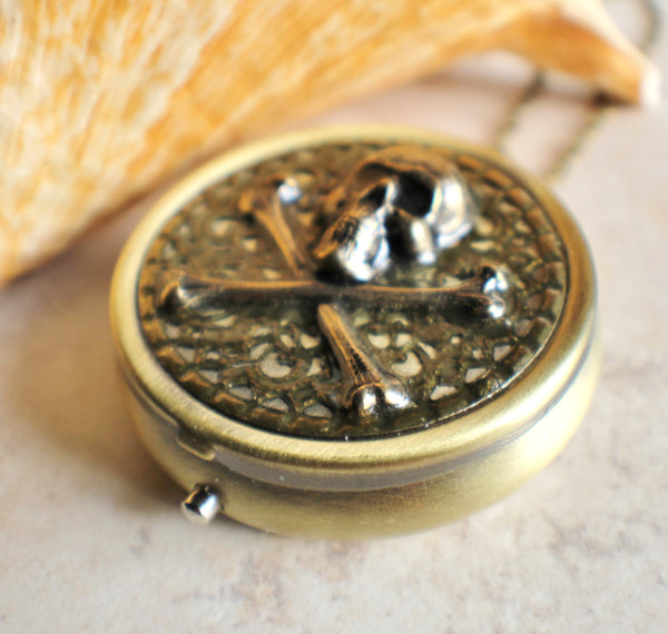 Skull and Crossbones music box locket.