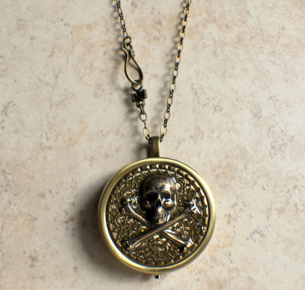Skull and Crossbones music box locket.