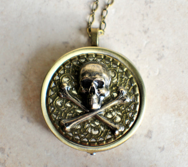 Skull and Crossbones music box locket.