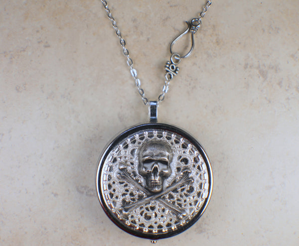 Skull and Crossbones Music Box Locket in Silver