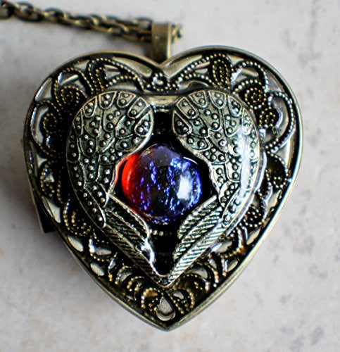 Angel wing music box locket, heart locket with music box inside with dragons breath cabochon.