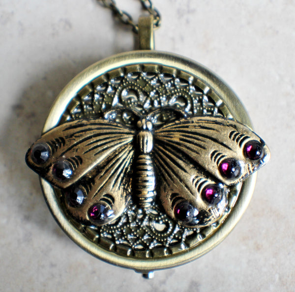 Music box locket,  round locket with music box inside, in bronze with filigree and butterfly adorning front cover. - Char's Favorite Things - 3