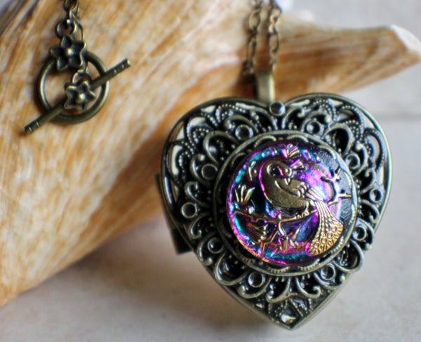 Peacock Music box locket, heart shaped with bronze accents.