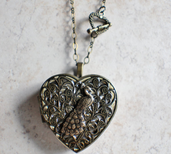 Peacock music box locket heart shaped in bronze