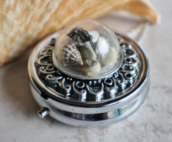 Nautical music box locket in silvertone