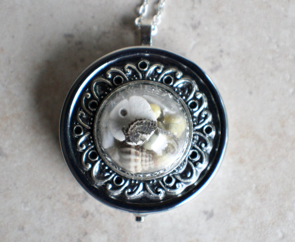 Nautical music box locket in silvertone