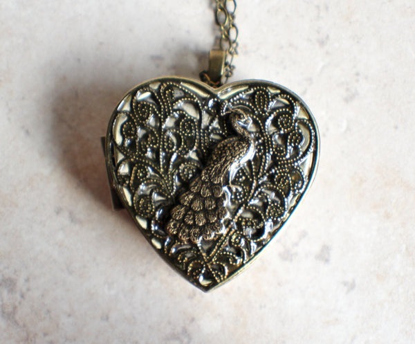 Peacock music box locket heart shaped in bronze