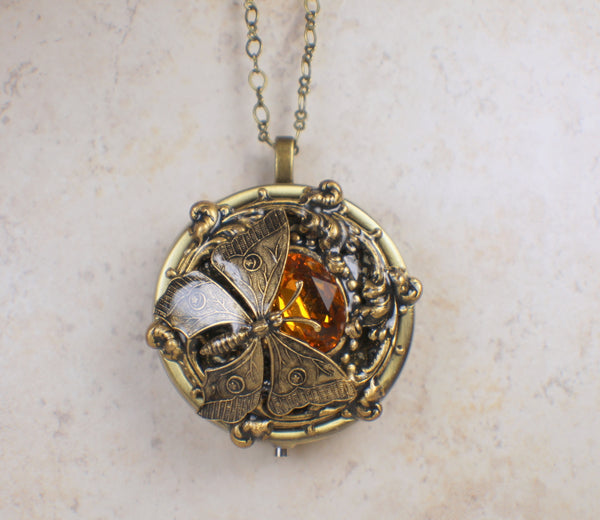 Round Amber Crystal Butterfly Music Box Locket