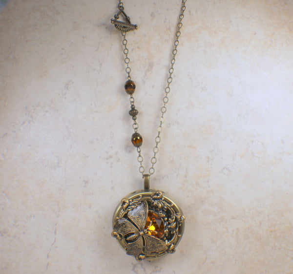 Round Amber Crystal Butterfly Music Box Locket