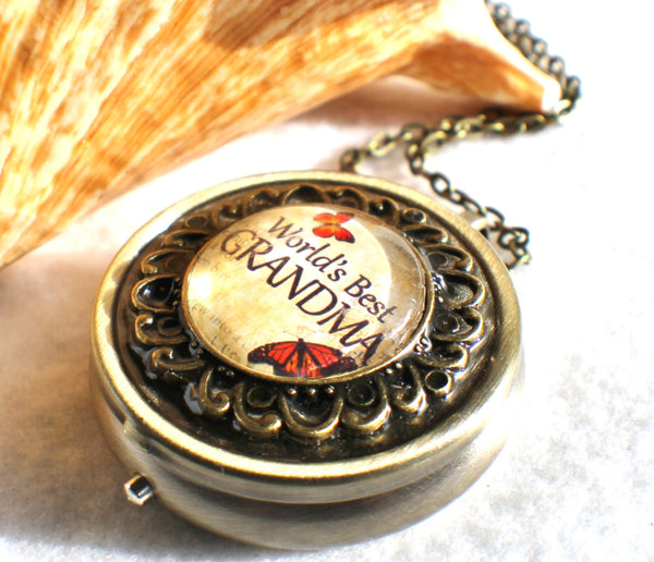 Music box locket,  round locket with music box inside, in silver tone or bronze with "World's Best Grandma" on cover. - Char's Favorite Things - 2