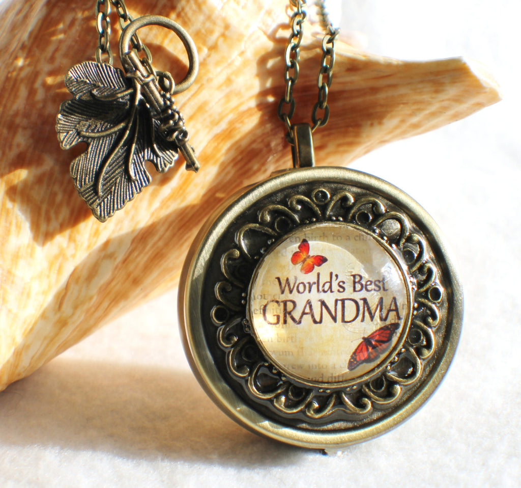 Music box locket,  round locket with music box inside, in silver tone or bronze with "World's Best Grandma" on cover. - Char's Favorite Things - 1