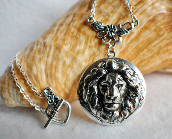 Lion photo locket, round silver tone locket with lion on front cover. - Char's Favorite Things - 1