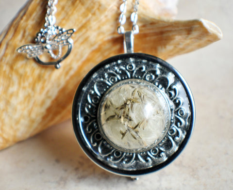 Music box locket,  round locket with music box inside, in silver with dandelion wishes encased in glass - Char's Favorite Things - 1