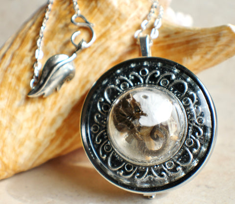 Music box locket,  round locket with music box inside, in silvertone with tiny sea life treasures encased in glass - Char's Favorite Things - 1