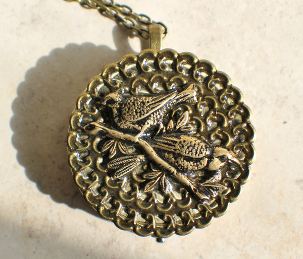 Music box locket, round bronze locket with music box inside, with a bronze filigree and a bronze birds on front cover. - Char's Favorite Things - 3