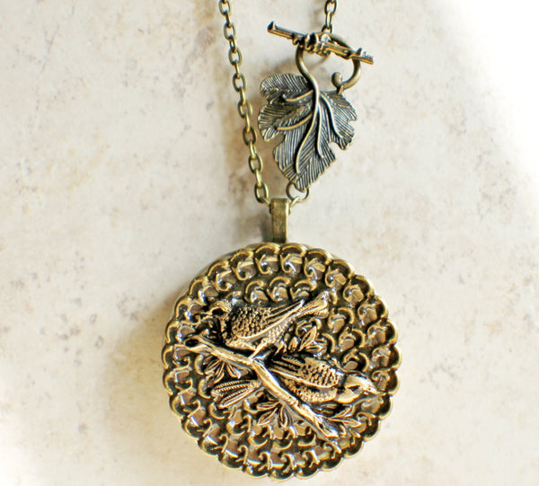 Music box locket, round bronze locket with music box inside, with a bronze filigree and a bronze birds on front cover. - Char's Favorite Things - 4