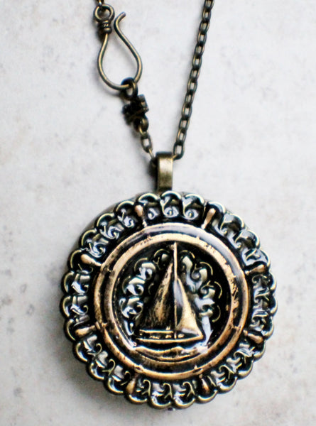 Music box locket, round bronze locket with music box inside, with a nautical theme featuring a sailboat on front cover. - Char's Favorite Things - 4