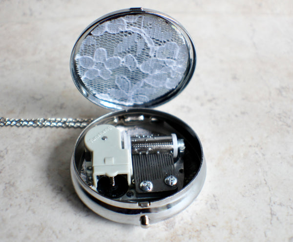 Music box locket, round silver tone locket with music box inside, with a nautical theme featuring a sailboat on front cover. - Char's Favorite Things - 5