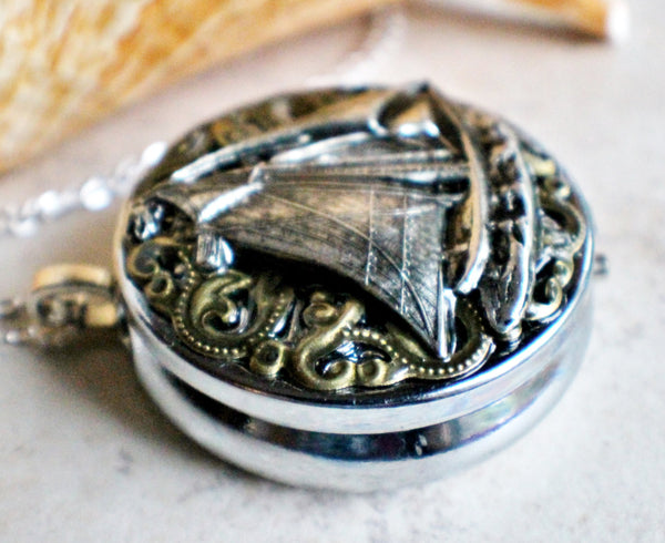 Music box locket, round silver tone locket with music box inside, with a nautical theme featuring a sailboat on front cover. - Char's Favorite Things - 2