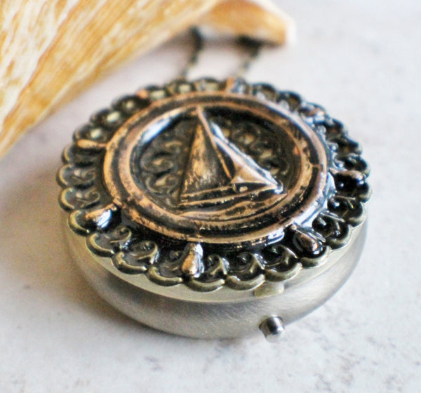 Music box locket, round bronze locket with music box inside, with a nautical theme featuring a sailboat on front cover. - Char's Favorite Things - 2