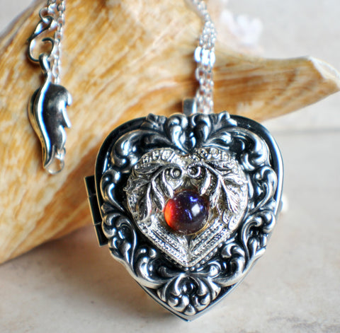 Music box locket, heart locket with music box inside, in silver tone with floral heart, angel wings and dragons breath opal cabochon. - Char's Favorite Things - 1